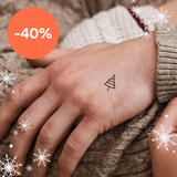 Tatouage d'un mini sapin de Noël