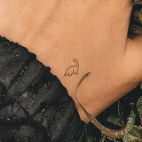 Petit tatouage de brontosaure