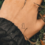 Petit tatouage T Rex