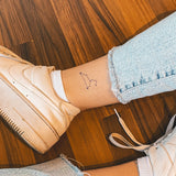 Le tatouage de la constellation du Lion