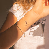 Tatouage coeur étroit et ouvert