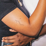 Tatouage Visages qui s'embrassent