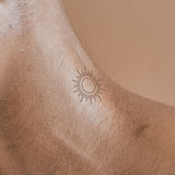 Tatouage de soleil en ligne 